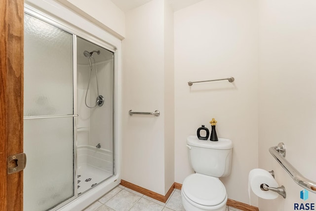 110 W Apple St, Tea, SD 57064 - full bathroom featuring a stall shower, baseboards, toilet, and tile patterned floors