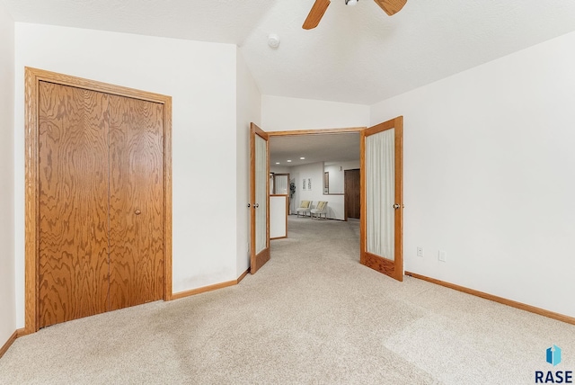 110 W Apple St, Tea, SD 57064 - unfurnished bedroom featuring carpet flooring, baseboards, ceiling fan, and lofted ceiling