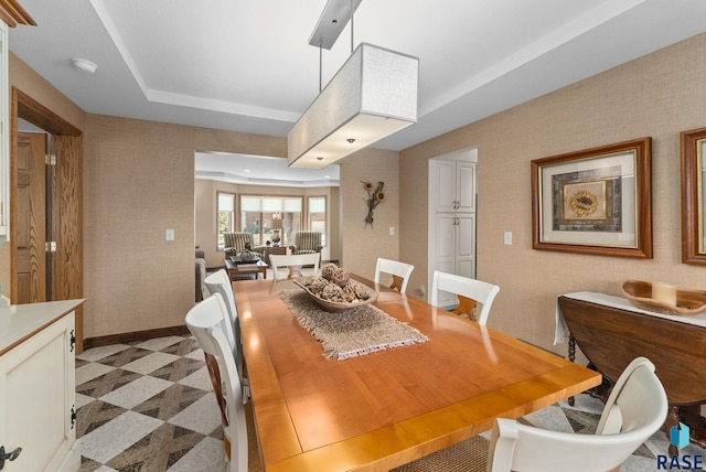 904 W Chicory Ln, Sioux Falls, SD 57108 - dining space with a raised ceiling, baseboards, and wallpapered walls