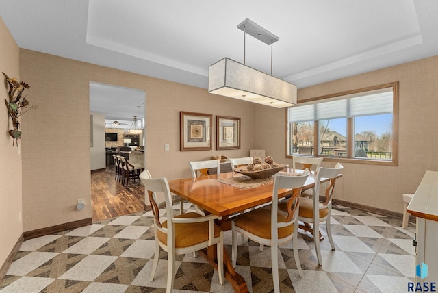 904 W Chicory Ln, Sioux Falls, SD 57108 - dining area with a tray ceiling and baseboards