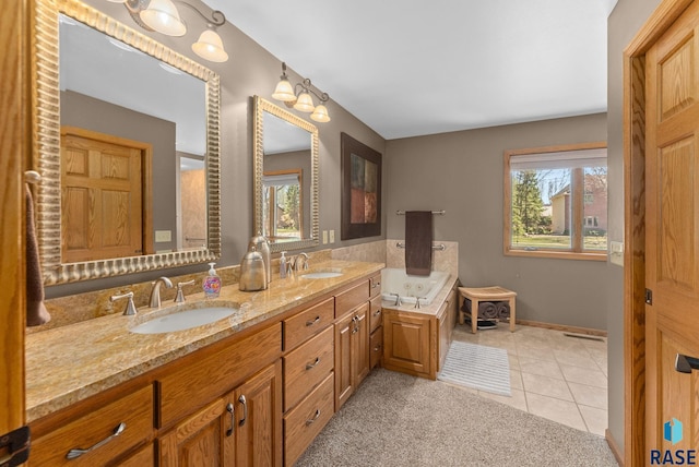 904 W Chicory Ln, Sioux Falls, SD 57108 - full bath with tile patterned flooring, double vanity, baseboards, and a bathtub