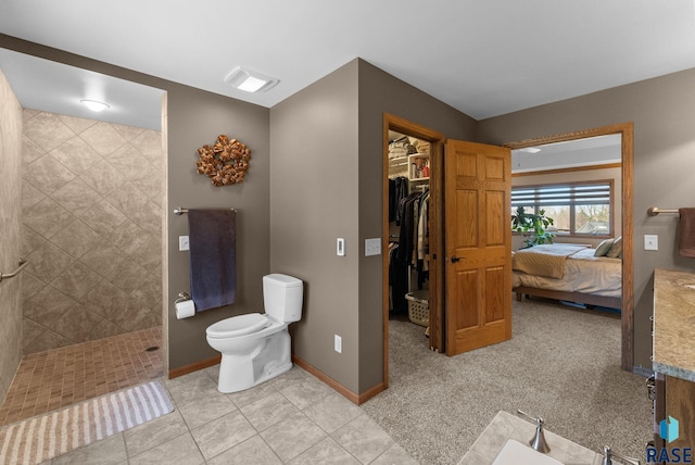 904 W Chicory Ln, Sioux Falls, SD 57108 - bathroom featuring a walk in shower, baseboards, toilet, tile patterned flooring, and ensuite bath