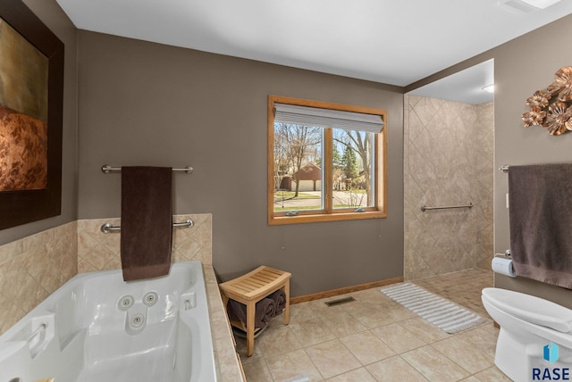 904 W Chicory Ln, Sioux Falls, SD 57108 - bathroom featuring a jetted tub, toilet, tile patterned flooring, a walk in shower, and baseboards