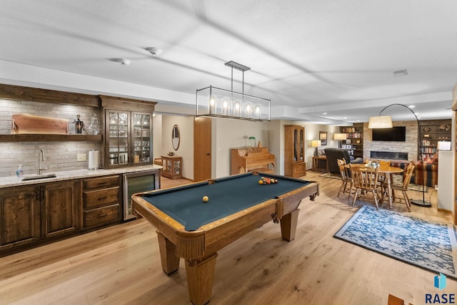 904 W Chicory Ln, Sioux Falls, SD 57108 - game room featuring bar with sink, billiards table, beverage cooler, and light wood finished floors