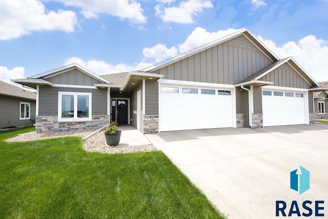 403 Granite Ave, Tea, SD 57064 - craftsman house with a garage, board and batten siding, concrete driveway, and stone siding