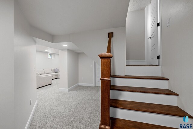 stairway featuring carpet floors, recessed lighting, and baseboards