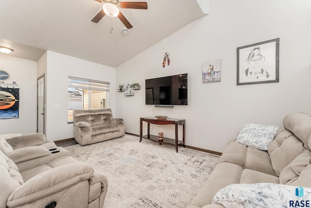 living area with a ceiling fan, baseboards, and high vaulted ceiling