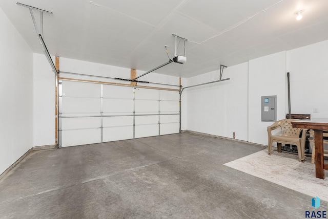 garage with a garage door opener and electric panel