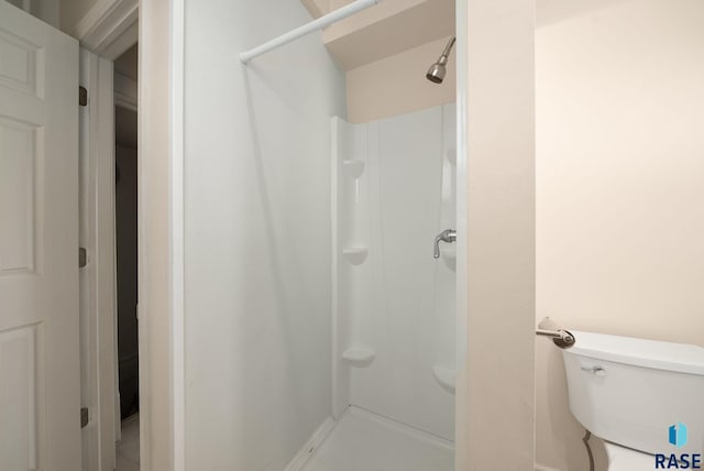 1420 W 10th St, Sioux Falls, SD 57104 - full bathroom featuring a stall shower and toilet
