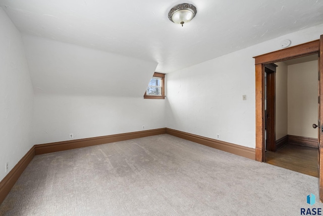 1420 W 10th St, Sioux Falls, SD 57104 - bonus room featuring carpet flooring, baseboards, and lofted ceiling