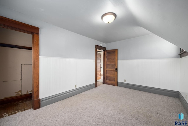 1420 W 10th St, Sioux Falls, SD 57104 - additional living space featuring carpet flooring, wainscoting, and vaulted ceiling