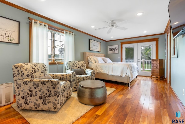 28262 472nd Ave, Worthing, SD 57077 - bedroom with ornamental molding, access to outside, multiple windows, french doors, and wood-type flooring