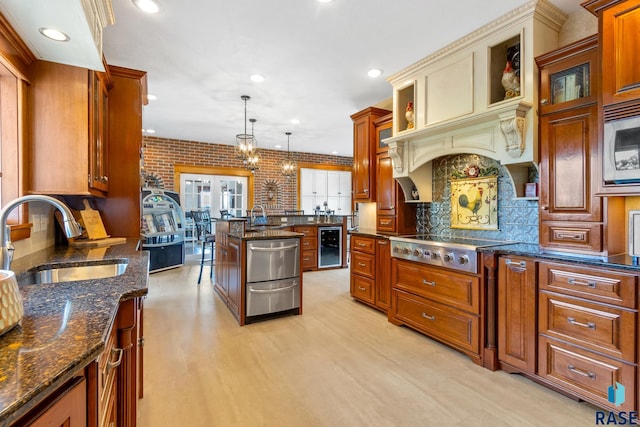 28262 472nd Ave, Worthing, SD 57077 - kitchen featuring a sink, wine cooler, stainless steel appliances, backsplash, and light wood-style flooring
