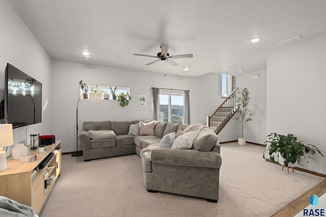 8162 E Tencate Pl, Sioux Falls, SD 57110 - living room featuring stairway, baseboards, light colored carpet, recessed lighting, and ceiling fan