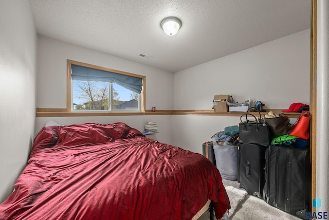 7708 W Eli Ct, Sioux Falls, SD 57106 - carpeted bedroom featuring a textured ceiling