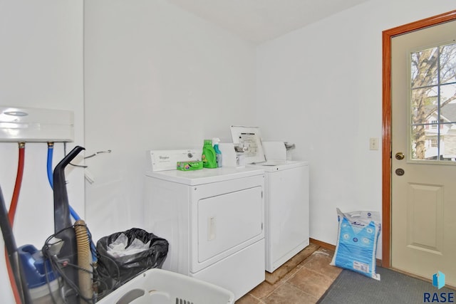310 Jackson St, Valley Springs, SD 57068 - laundry area with washer and dryer and baseboards