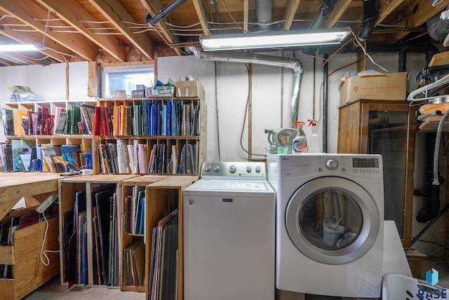 clothes washing area featuring independent washer and dryer