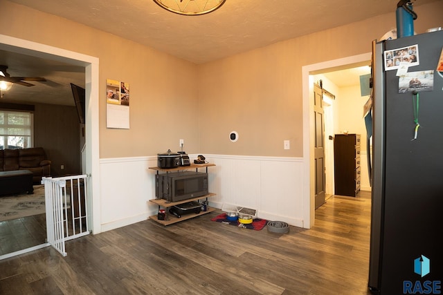 333 S Depot Ave, Garretson, SD 57030 - dining room with wood finished floors, ceiling fan, wainscoting, and a textured ceiling