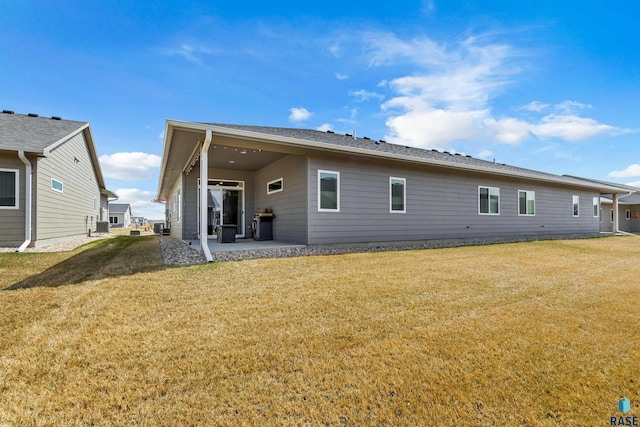 5307 S Dubuque Ave, Sioux Falls, SD 57108 - back of property with a patio area and a yard