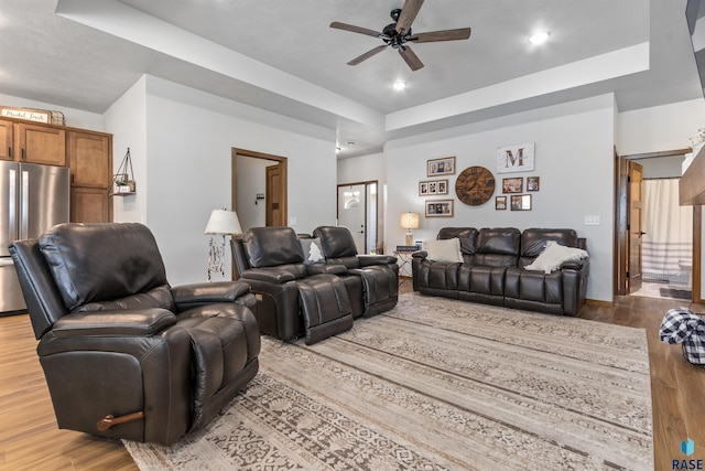 5307 S Dubuque Ave, Sioux Falls, SD 57108 - living area featuring a tray ceiling, a ceiling fan, wood finished floors, and recessed lighting