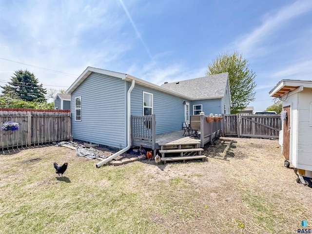 rear view of house with a wooden deck