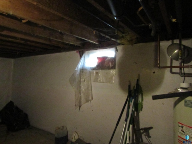 unfinished basement with water heater