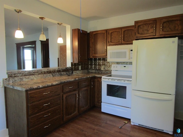 kitchen featuring white appliances, backsplash, dark wood finished floors, and decorative light fixtures