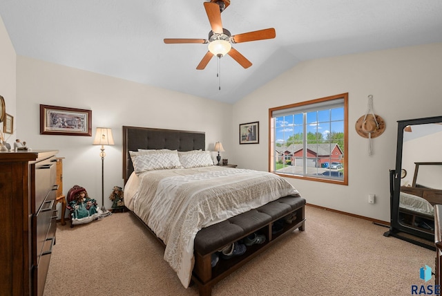 bedroom with light carpet, lofted ceiling, ceiling fan, and baseboards