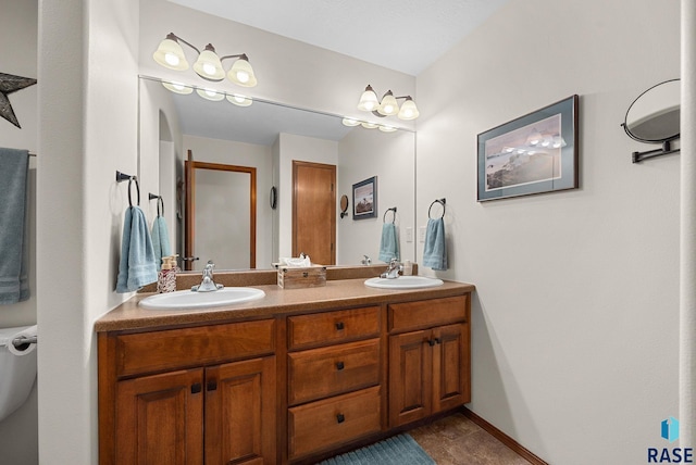 bathroom with double vanity, tile patterned floors, and a shower with door