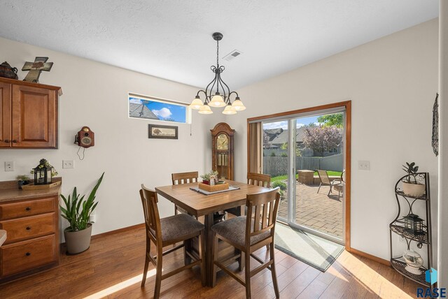 dining room featuring light wood-type flooring and baseboards