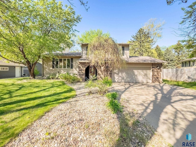 view of front of house featuring driveway and an attached garage