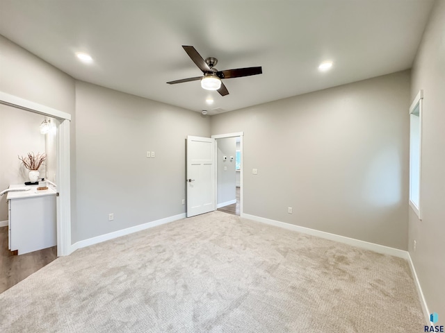 unfurnished bedroom featuring carpet, baseboards, recessed lighting, and a ceiling fan