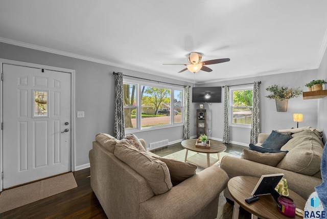 living area featuring ceiling fan, dark wood-style flooring, crown molding, and baseboards