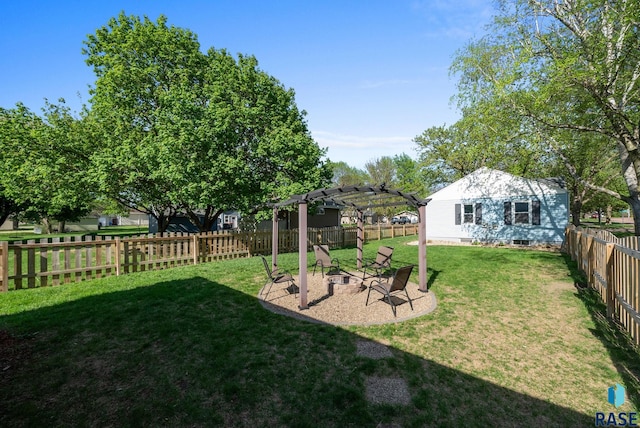 view of yard with a pergola, a fire pit, and a patio