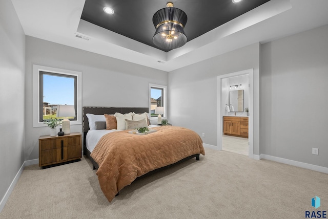 6609 E Corsair Dr, Sioux Falls, SD 57110 - bedroom featuring a raised ceiling, light carpet, baseboards, multiple windows, and recessed lighting