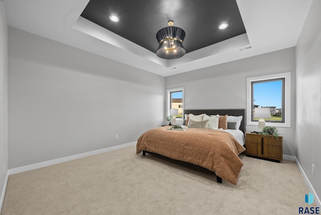 6609 E Corsair Dr, Sioux Falls, SD 57110 - carpeted bedroom featuring a raised ceiling, baseboards, and recessed lighting