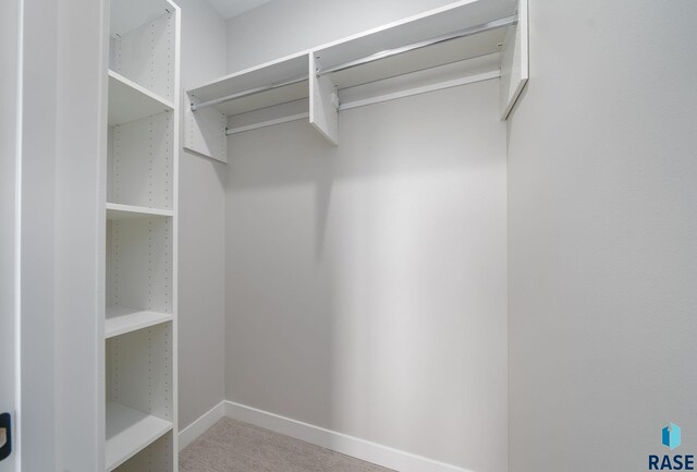 6609 E Corsair Dr, Sioux Falls, SD 57110 - walk in closet with carpet flooring