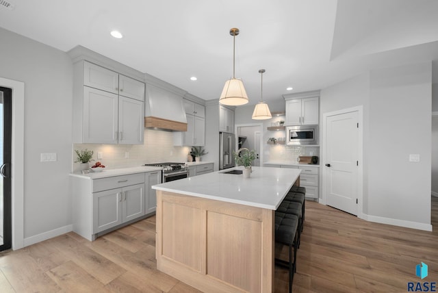 6609 E Corsair Dr, Sioux Falls, SD 57110 - kitchen featuring premium appliances, baseboards, light countertops, gray cabinets, and recessed lighting