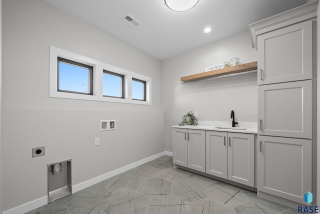 6609 E Corsair Dr, Sioux Falls, SD 57110 - laundry area with hookup for an electric dryer, baseboards, cabinet space, washer hookup, and recessed lighting