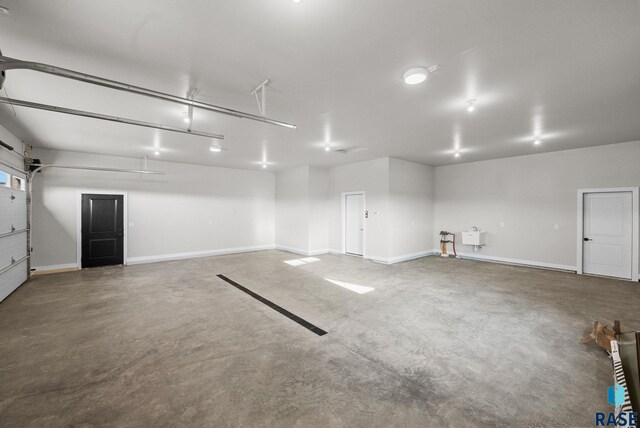 6609 E Corsair Dr, Sioux Falls, SD 57110 - garage featuring baseboards