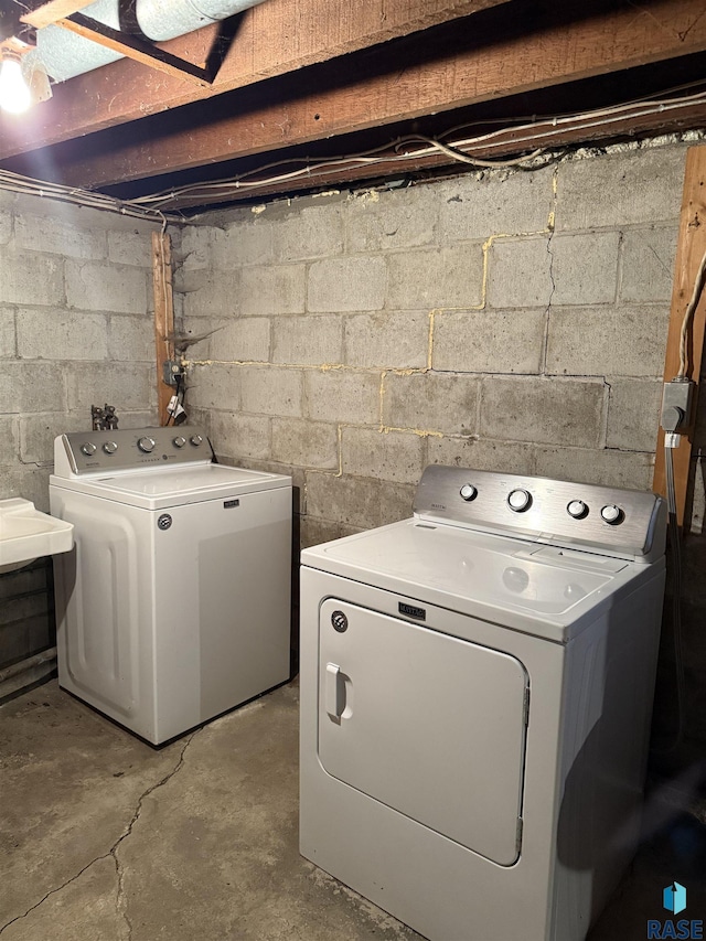 clothes washing area with independent washer and dryer