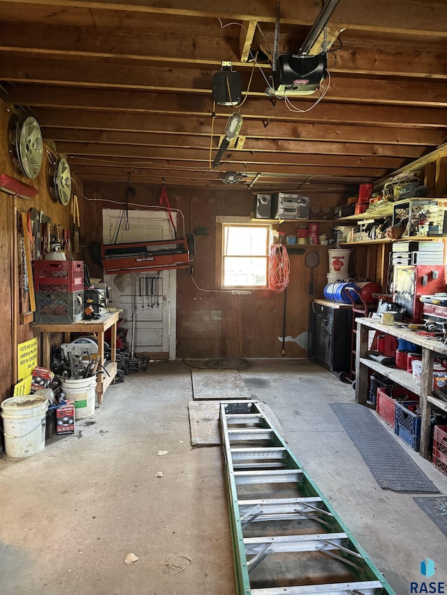 miscellaneous room featuring a workshop area and a garage