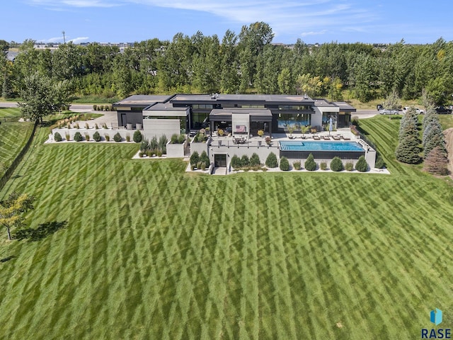 rear view of house with a lawn