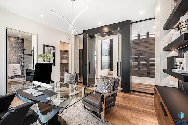 office featuring light wood finished floors and recessed lighting