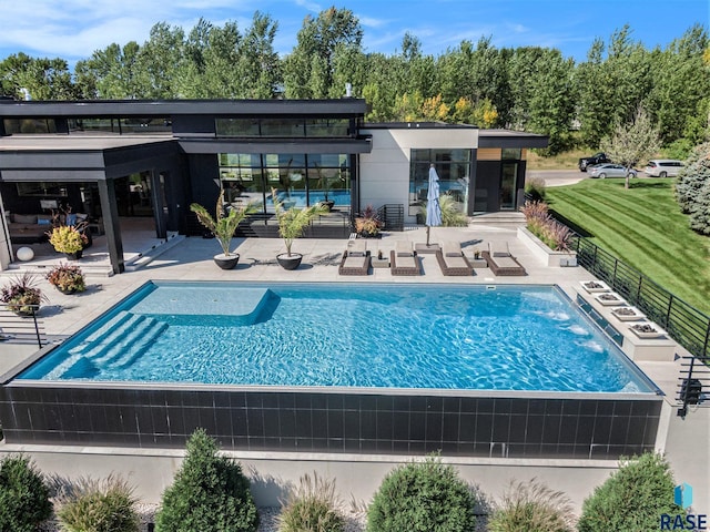 outdoor pool featuring a patio area and fence