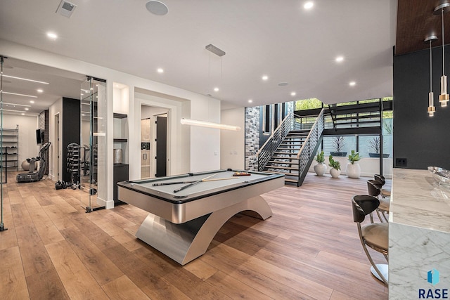 rec room with light wood-style flooring, pool table, floor to ceiling windows, and recessed lighting