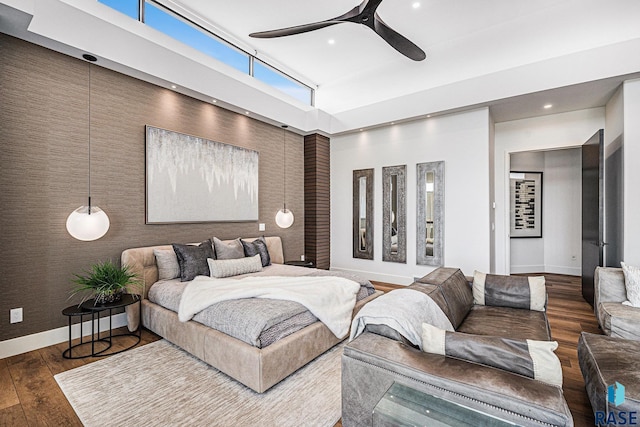 bedroom featuring wood finished floors, recessed lighting, baseboards, and a ceiling fan