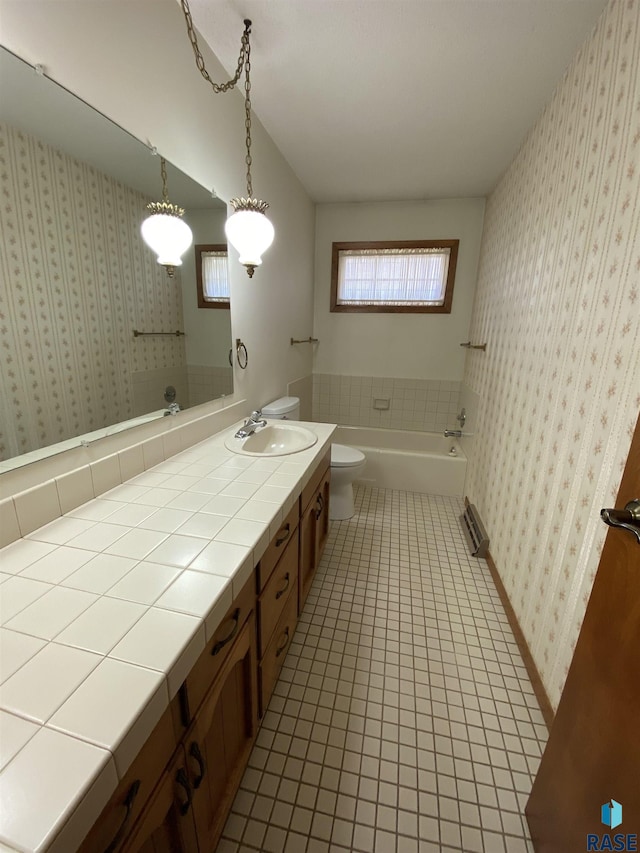 1208 Hampshire Cir, Luverne, MN 56156 - bathroom with toilet, tile patterned floors, vanity, and a tub