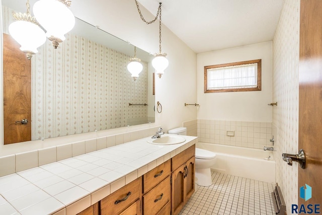 1208 Hampshire Cir, Luverne, MN 56156 - bathroom with tile patterned floors, toilet, a tub, and vanity