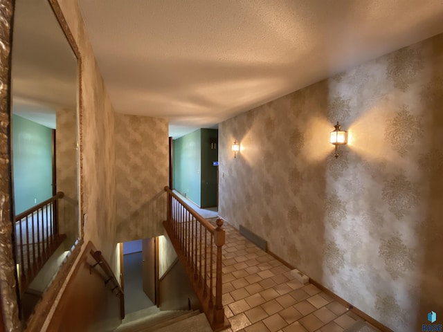 1208 Hampshire Cir, Luverne, MN 56156 - staircase featuring a textured ceiling